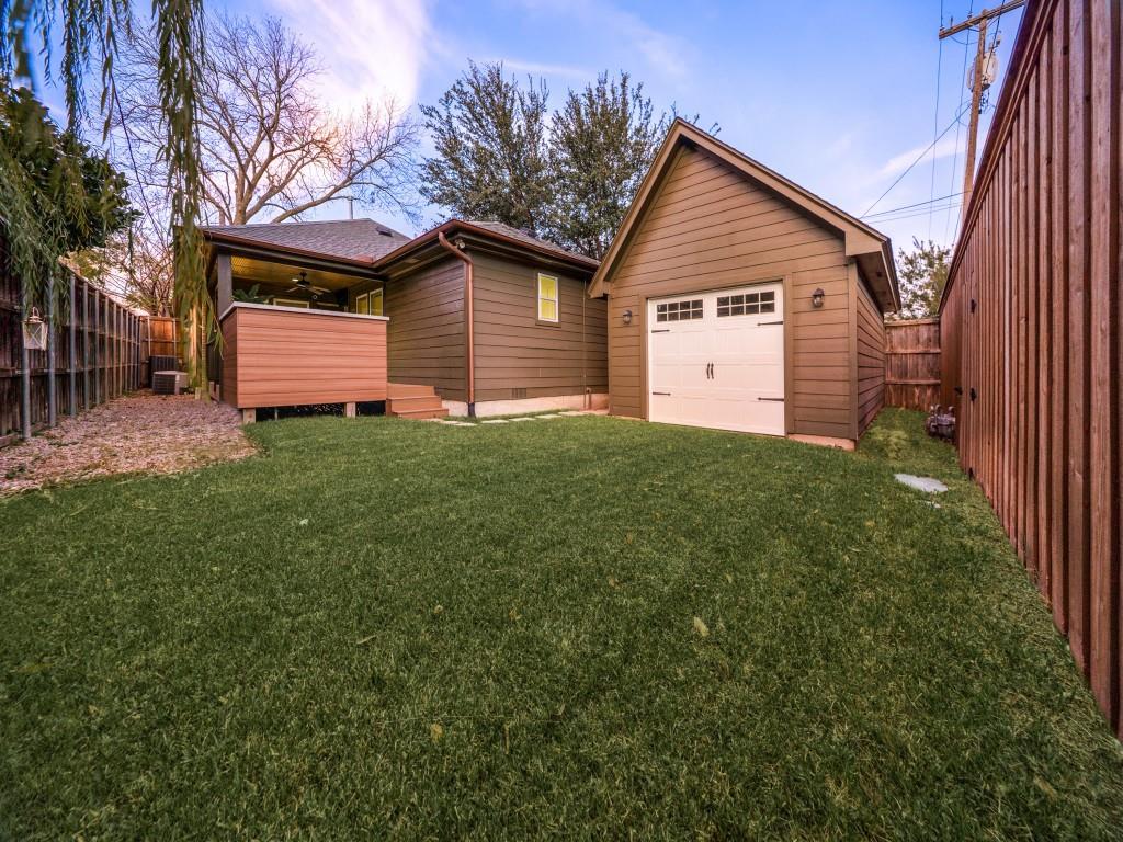 5514 Monticello Avenue Dallas, TX 75206 - Photo 20 of 20 a front view of a house with a yard and garage