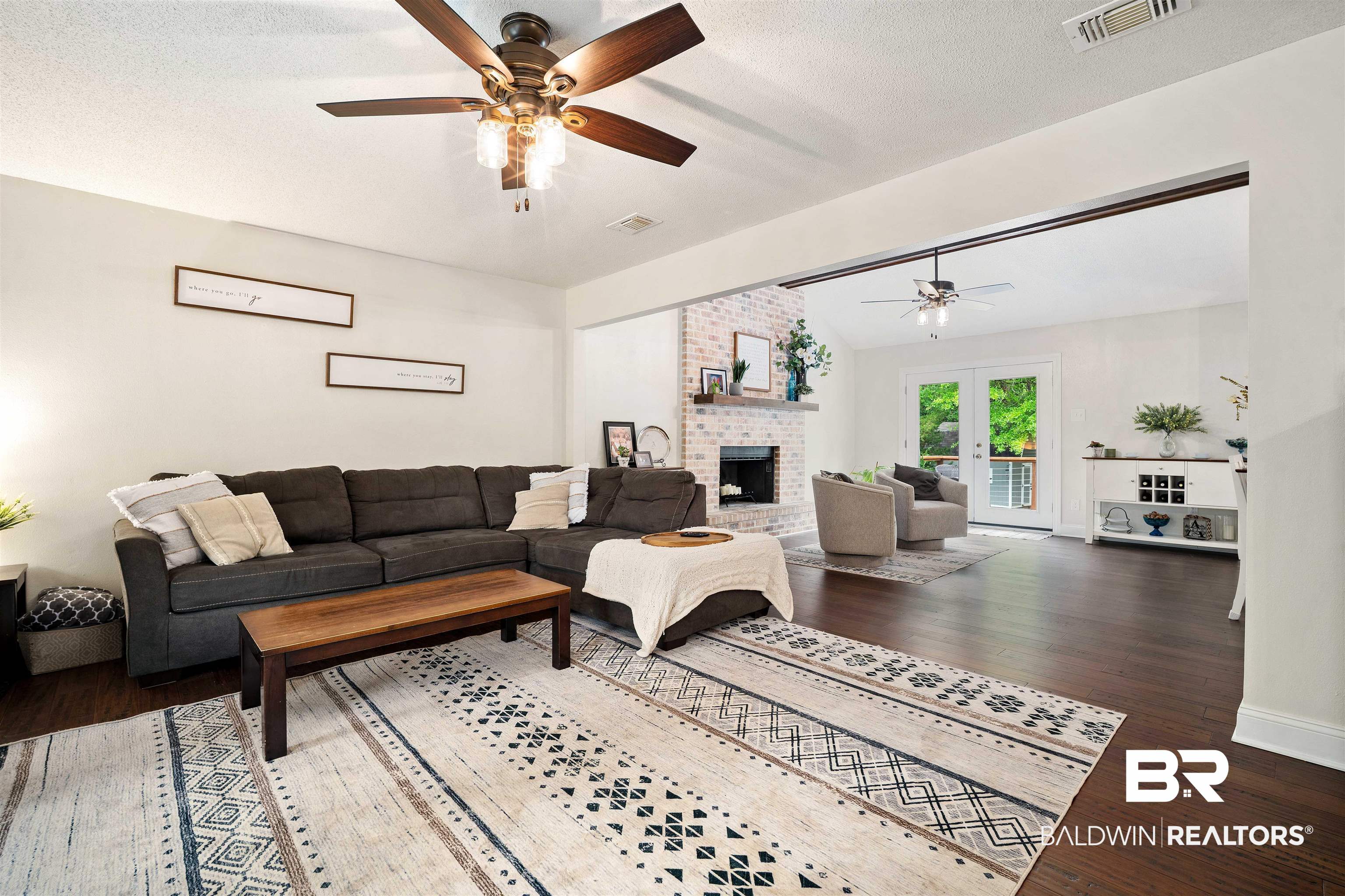 71 Caisson Trace Daphne, AL 36527 - Photo 7 of 36 Spacious living area featuring rich wood-finish flooring and a ceiling fan