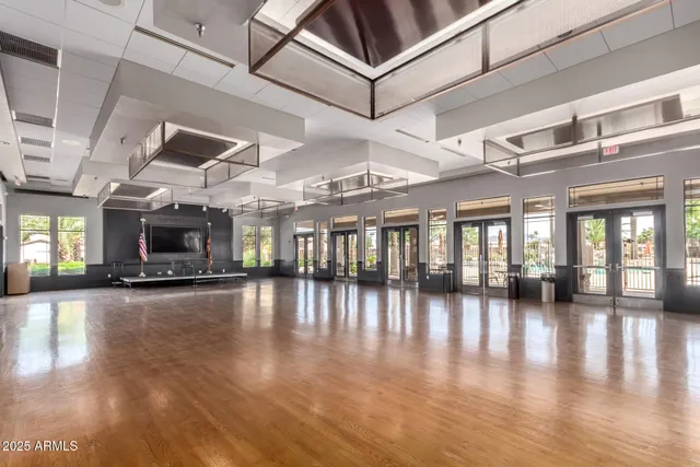 a view of a hall with wooden floor