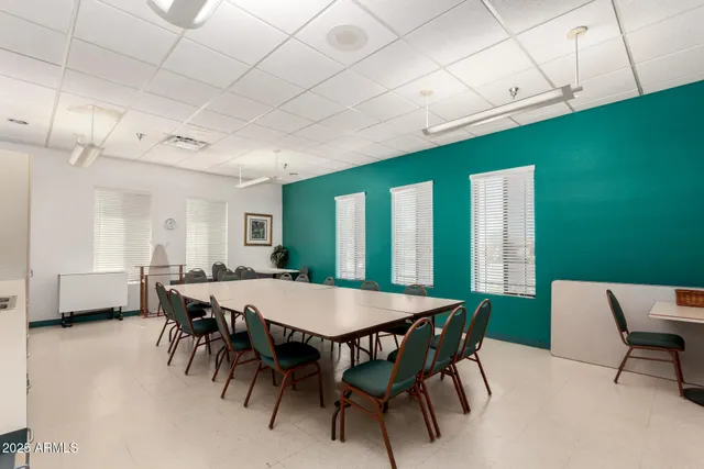 a dining room with furniture and window