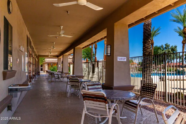 a lobby with furniture and floor to ceiling window