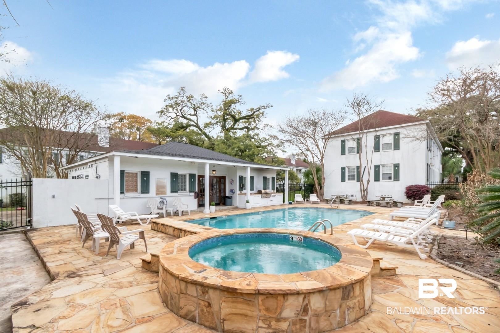214 Upham Street, Unit 17C Mobile, AL 36607 - Photo 8 of 32 View of pool featuring an in-ground hot tub and patio surround