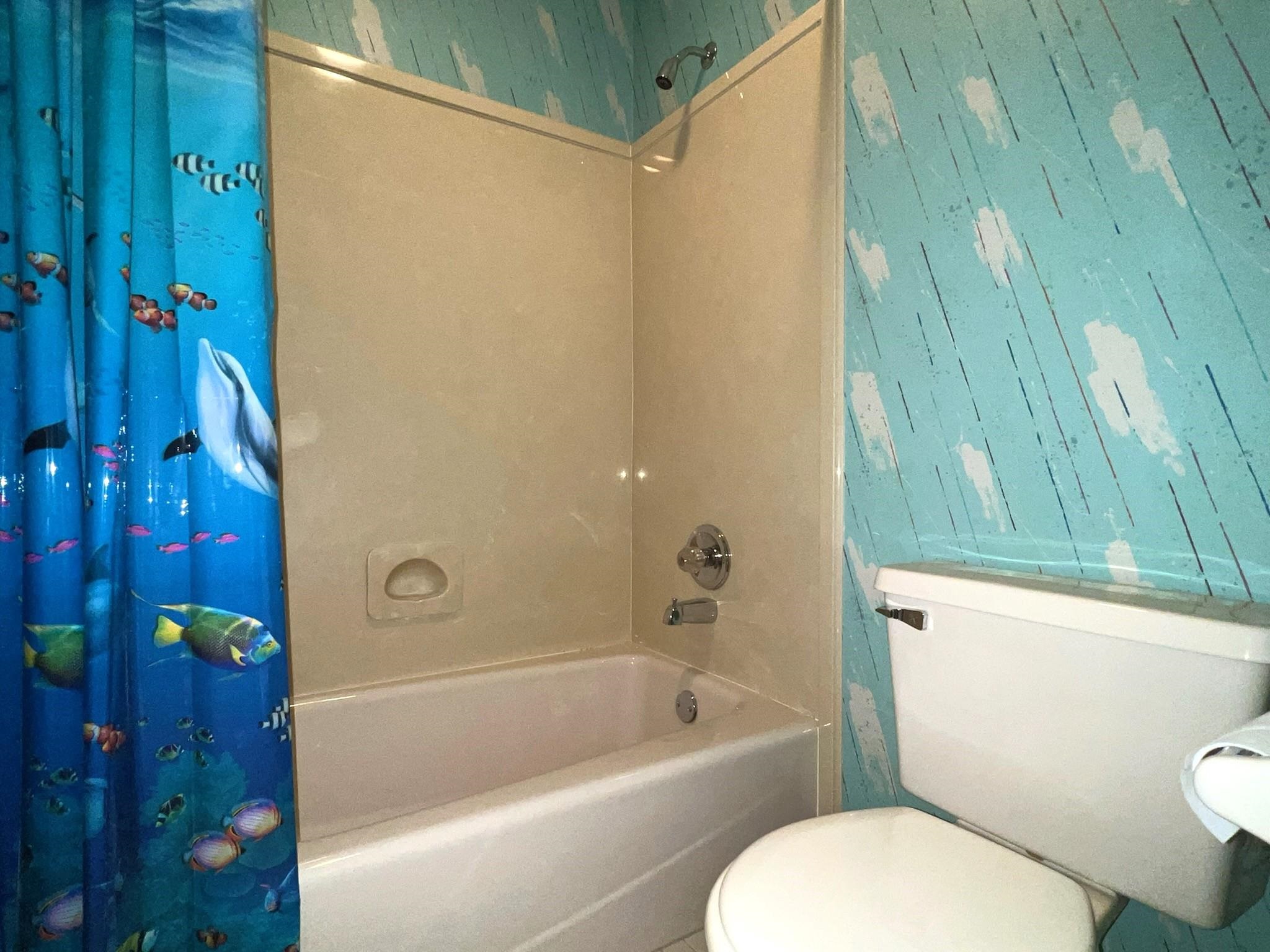 6588 Finch Road Memphis, TN 38141 - Photo 13 of 25 a bathroom with a toilet and a bathtub