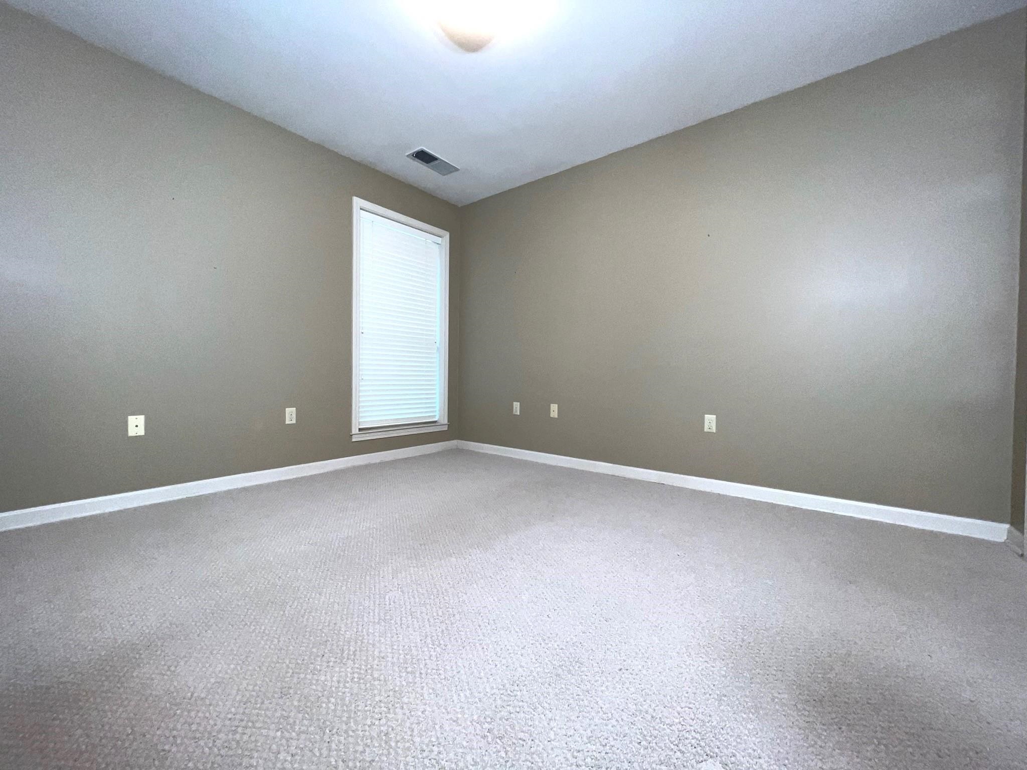 6588 Finch Road Memphis, TN 38141 - Photo 15 of 25 a view of an empty room with a window