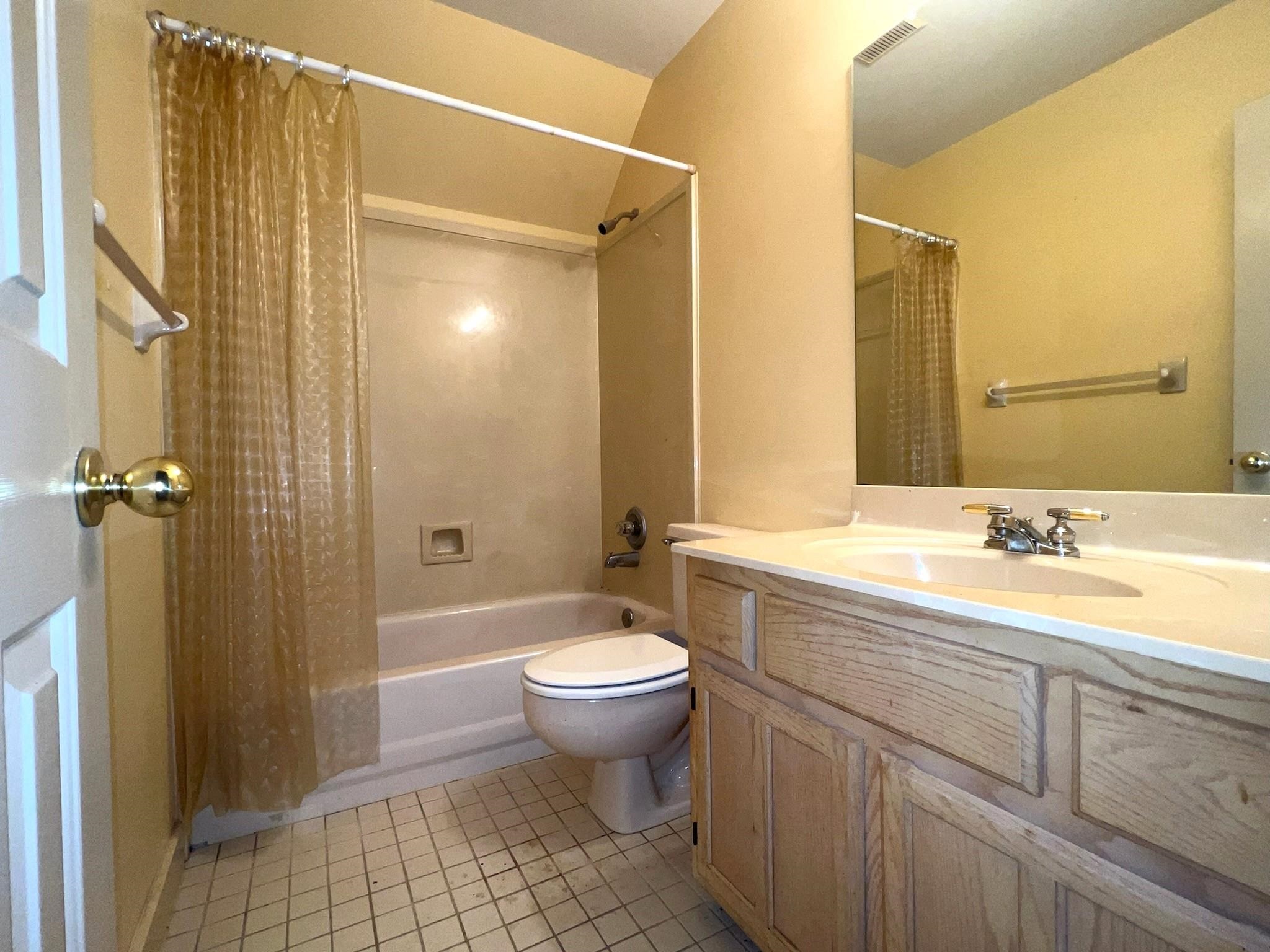 6588 Finch Road Memphis, TN 38141 - Photo 18 of 25 a bathroom with a granite countertop sink toilet and shower