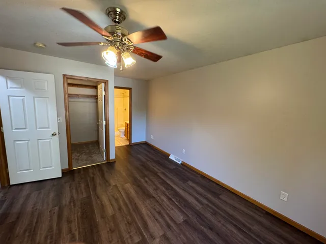 a view of an empty room and wooden floor