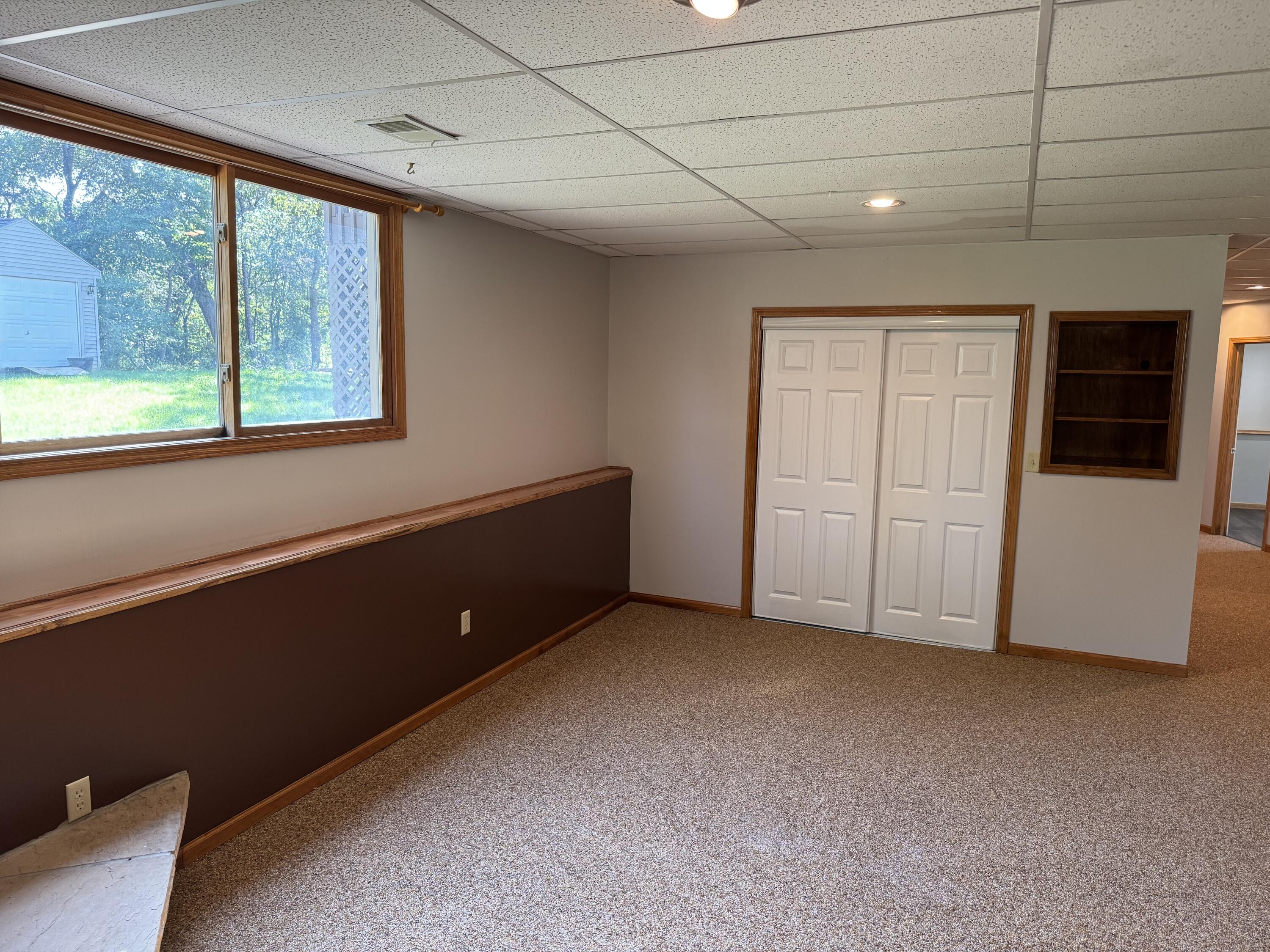10603 Georgetown Drive Demotte, IN 46310 - Photo 21 of 31 a view of an empty room with a window