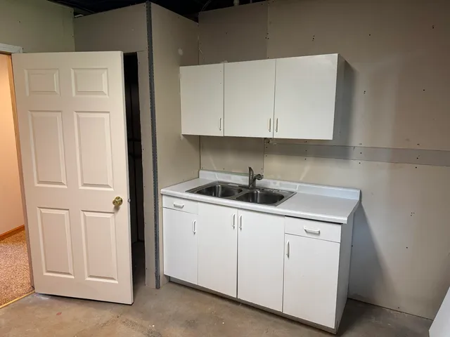 a kitchen with white cabinets