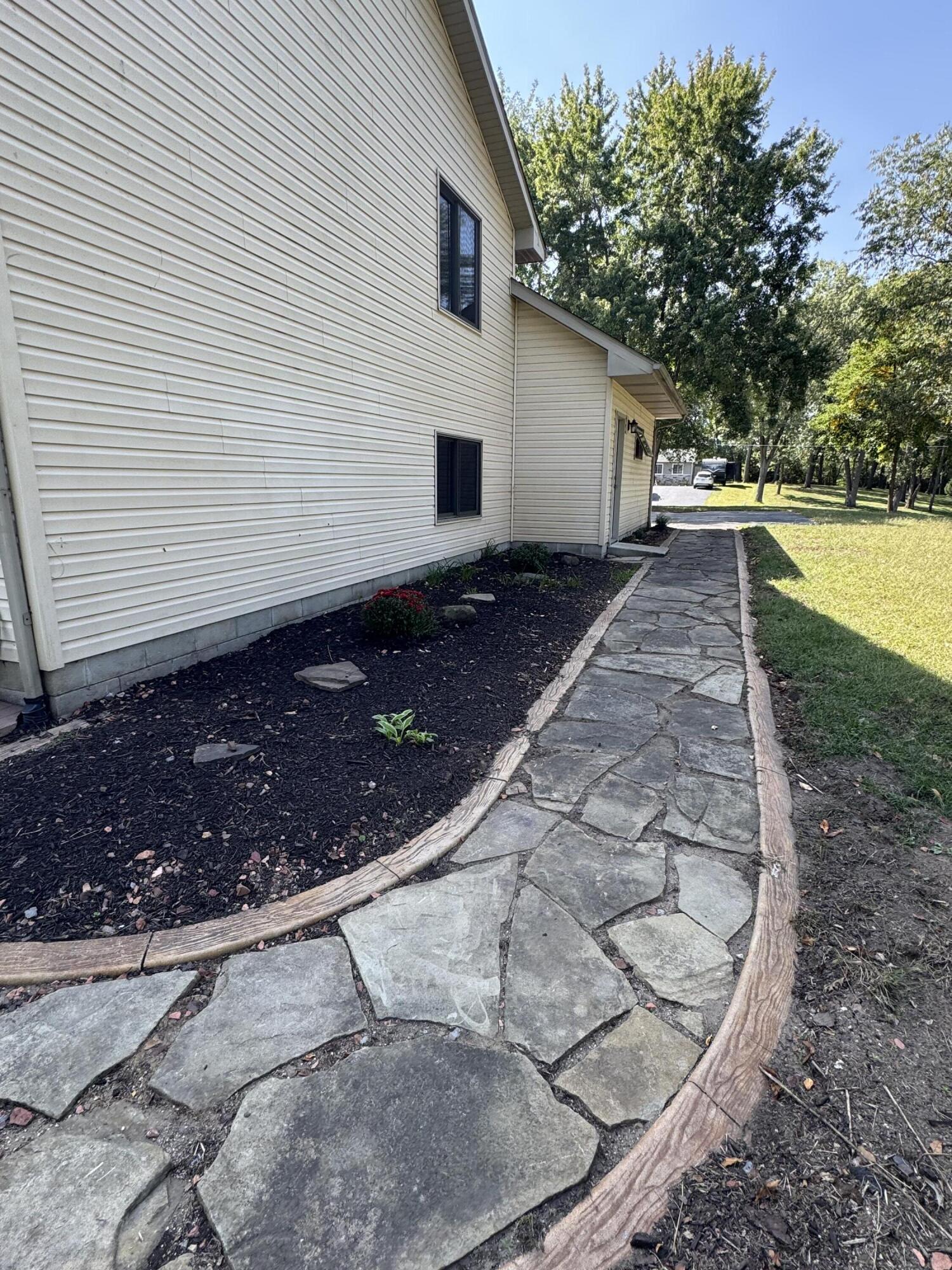 10603 Georgetown Drive Demotte, IN 46310 - Photo 31 of 31 a view of a backyard with large trees