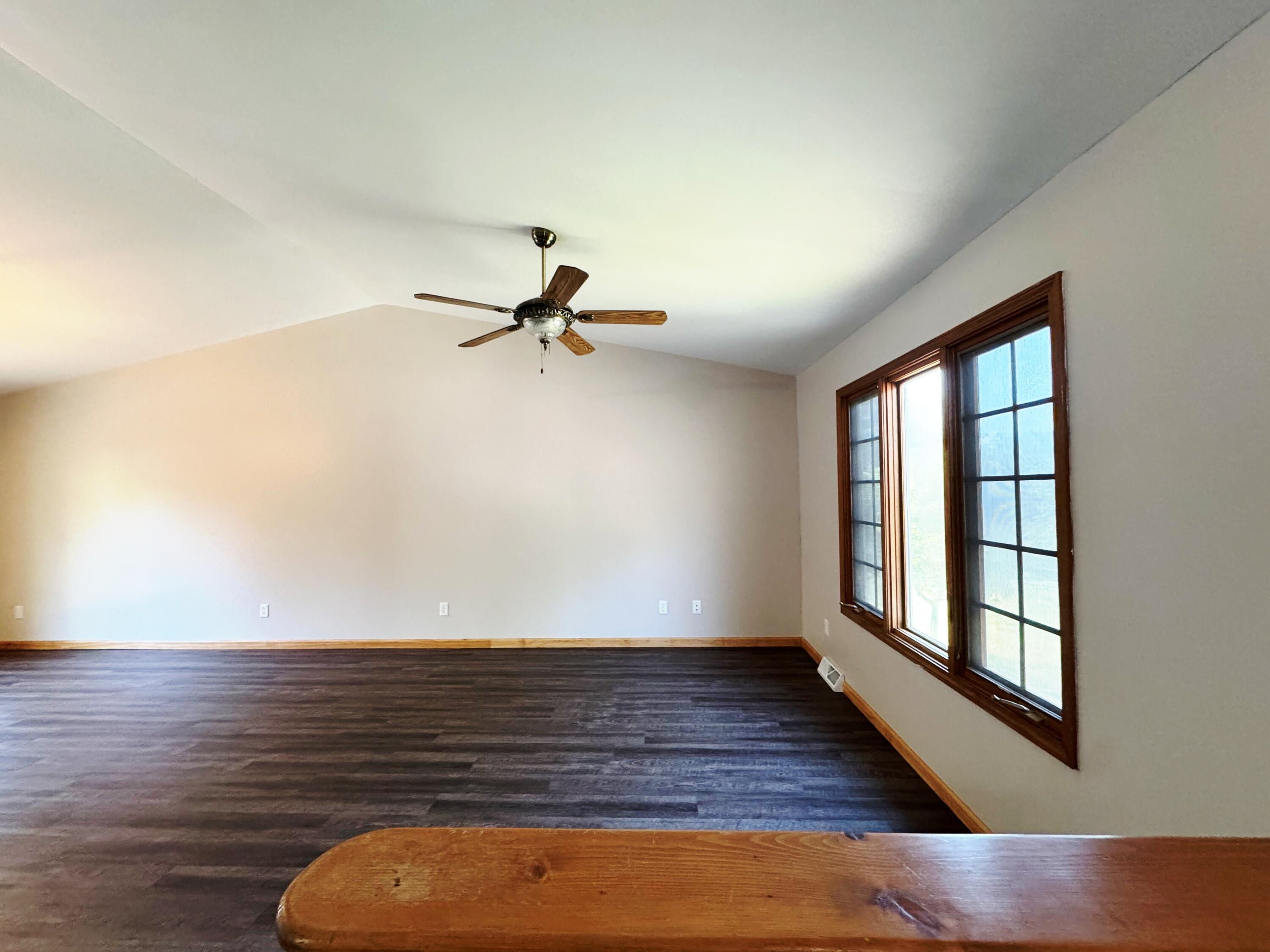 10603 Georgetown Drive Demotte, IN 46310 - Photo 4 of 31 a view of empty room with wooden floor and fan