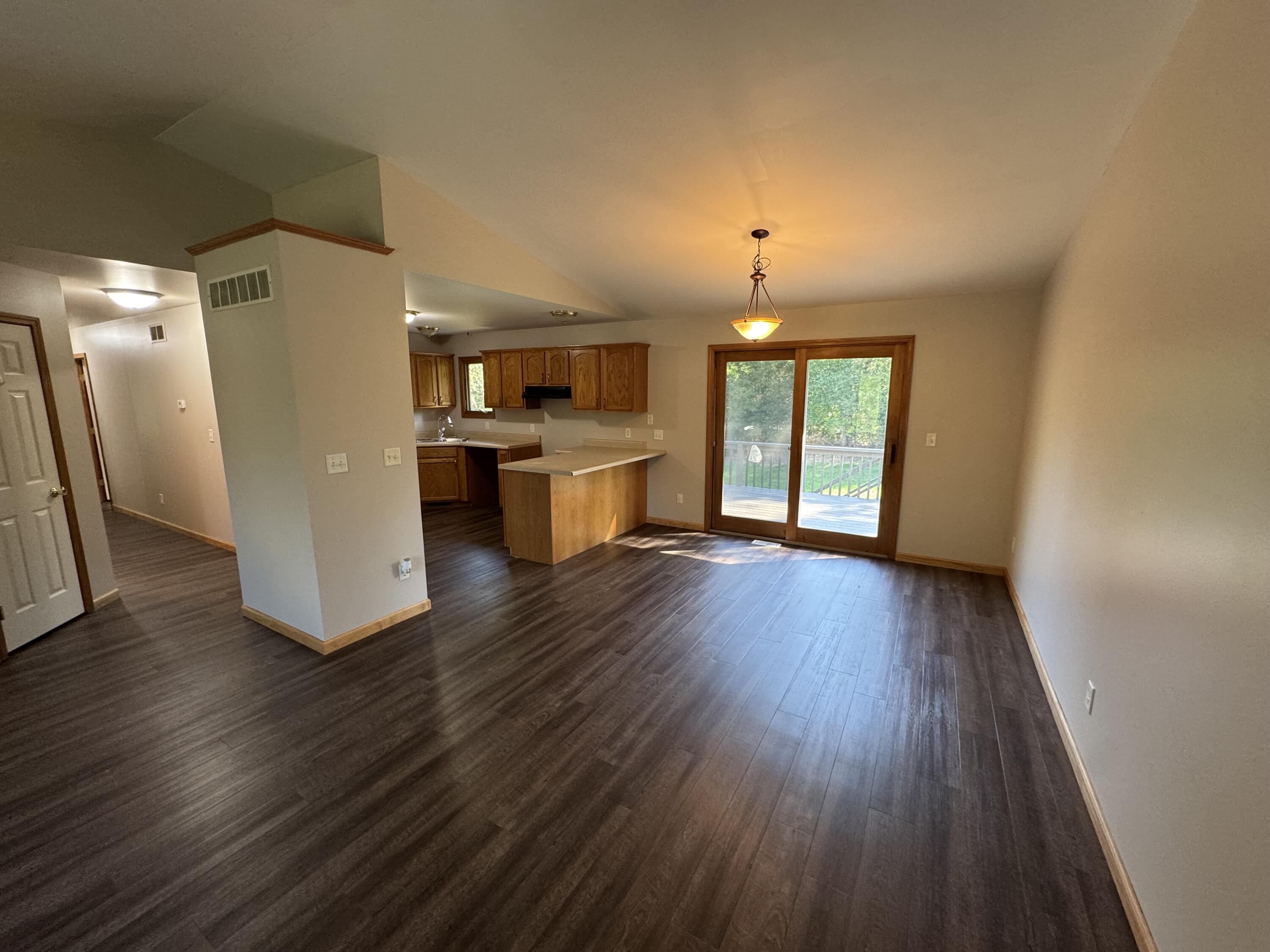10603 Georgetown Drive Demotte, IN 46310 - Photo 6 of 31 wooden floor in an empty room with a window
