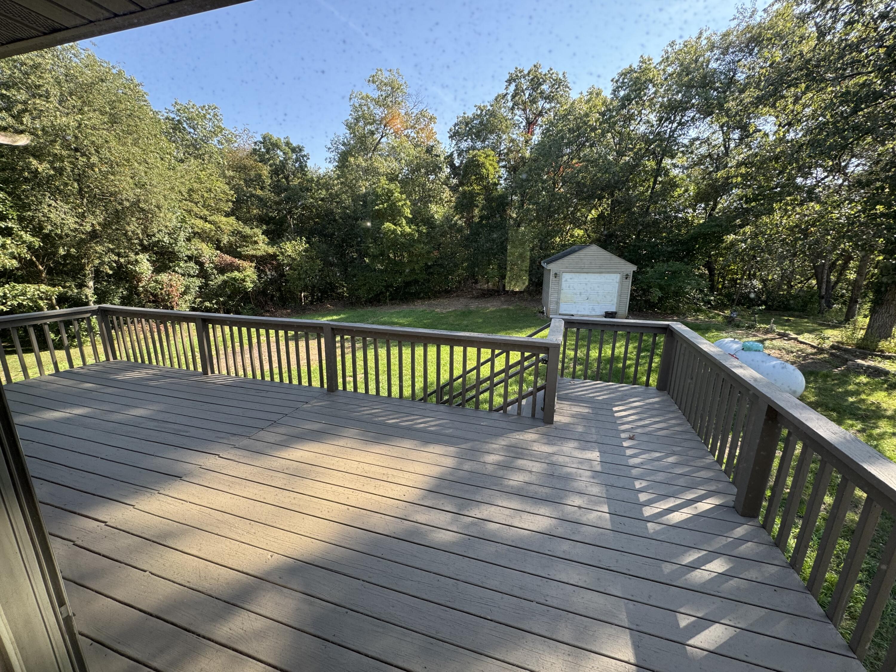 10603 Georgetown Drive Demotte, IN 46310 - Photo 8 of 31 a view of deck with wooden floor and fence