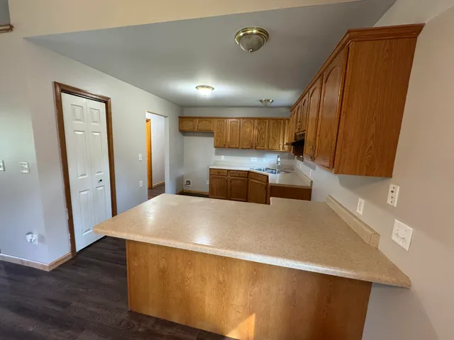 a kitchen with stainless steel appliances a refrigerator and a stove