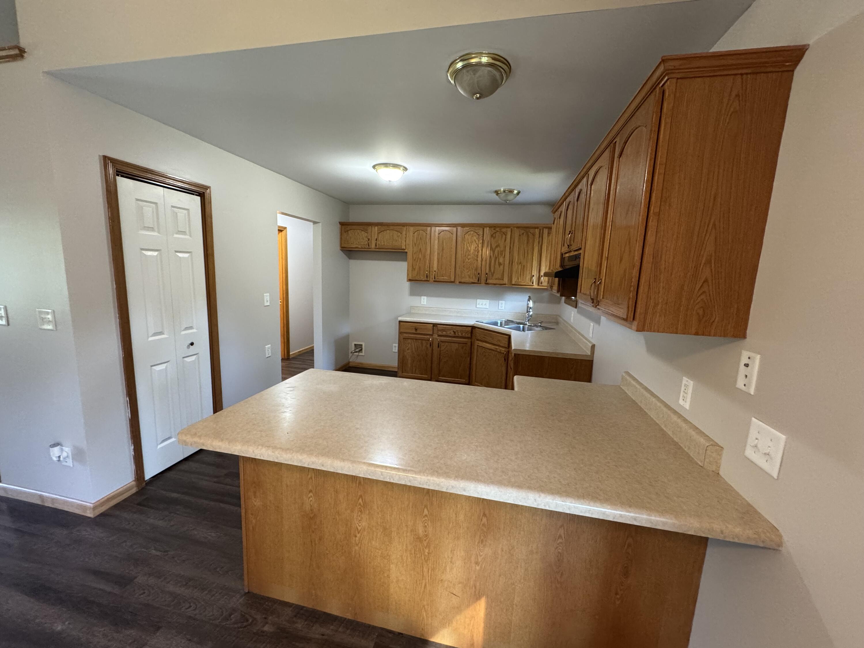 10603 Georgetown Drive Demotte, IN 46310 - Photo 10 of 31 a kitchen with stainless steel appliances a refrigerator and a stove