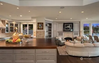 a kitchen with counter space furniture and a large window