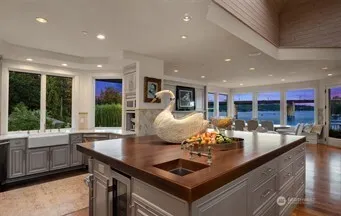 a kitchen with sink stove and cabinets