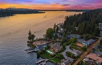 a view of a patio with swimming pool table and chairs