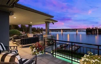 a terrace with outdoor seating and city view
