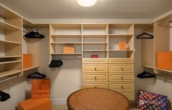 a bedroom with a large bed and a large window