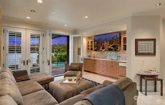 a bed sitting in a bedroom next to a window with garden view