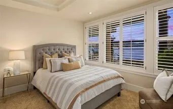 a view of a lake with sitting area