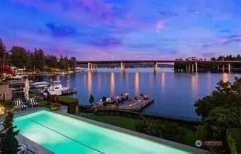 a view of a city with lush green forest