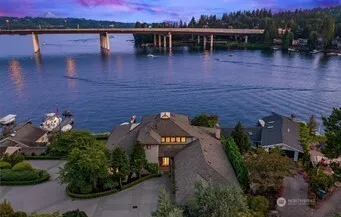 an aerial view of a house with outdoor space and a patio