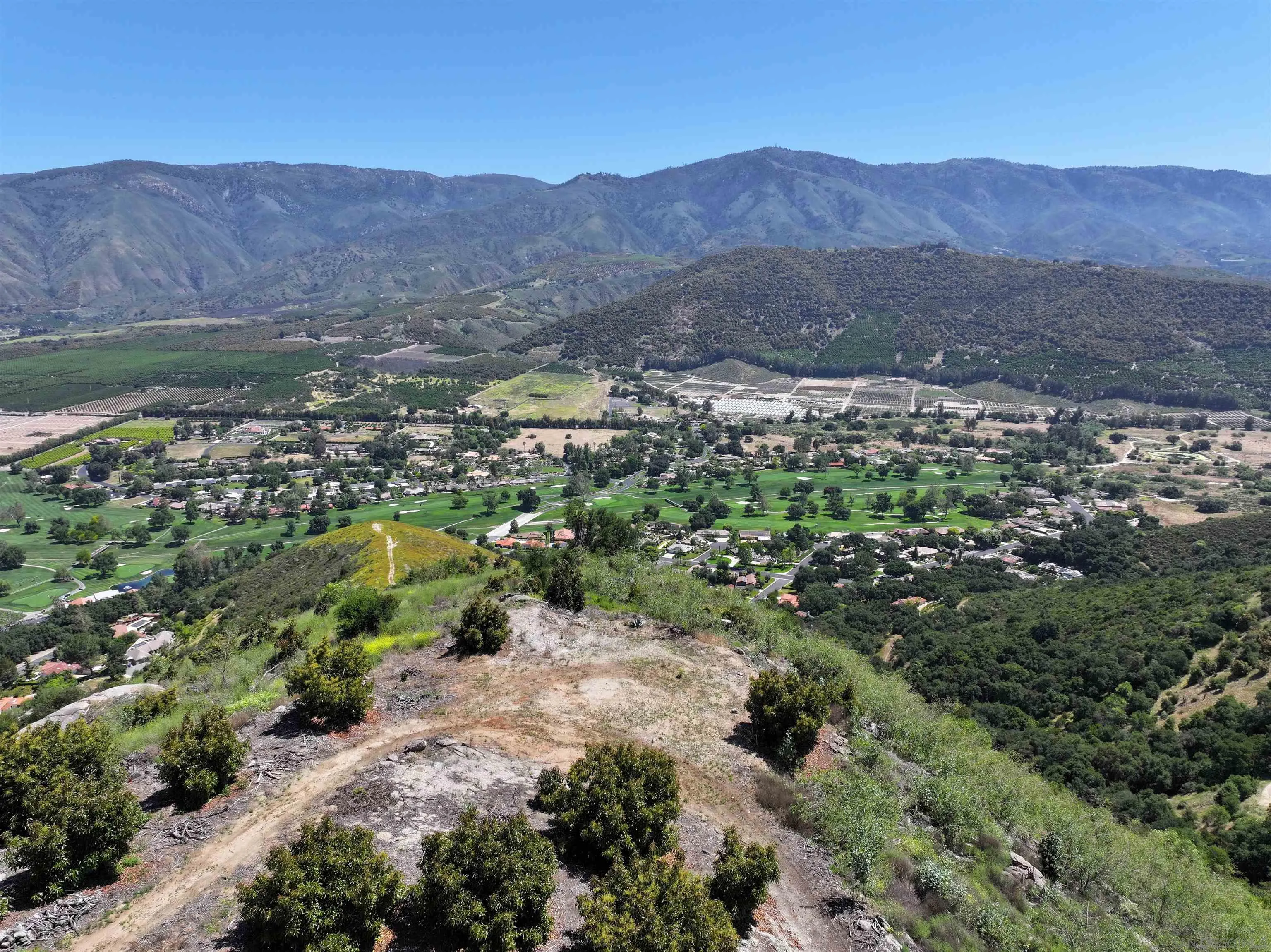 31752 Pauma Heights Road, Unit 1 Valley Center, CA 92061 - Photo 2 of 7 an aerial view of residential house and green space