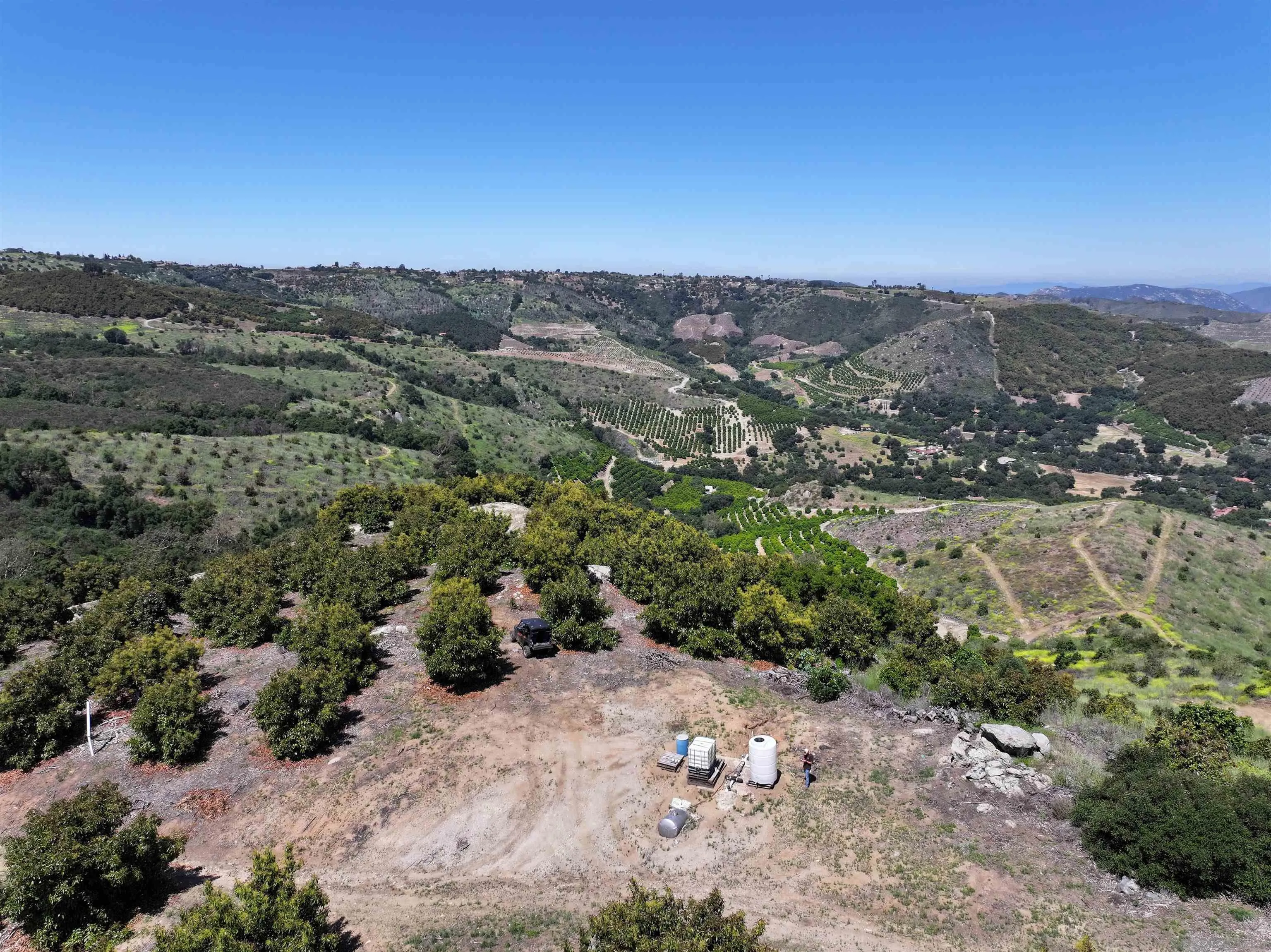31752 Pauma Heights Road, Unit 1 Valley Center, CA 92061 - Photo 4 of 7 an aerial view of a houses with a yard