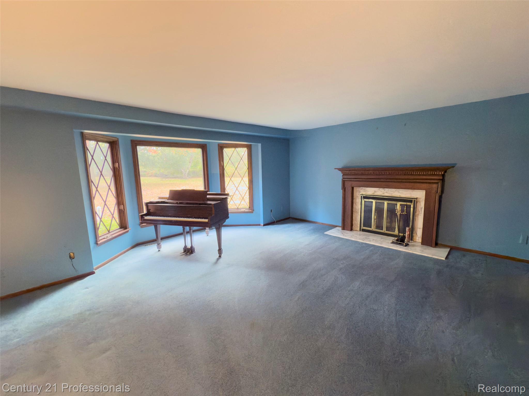 303 East Snell Road Rochester, MI 48306 - Photo 15 of 45 Living room with fire place