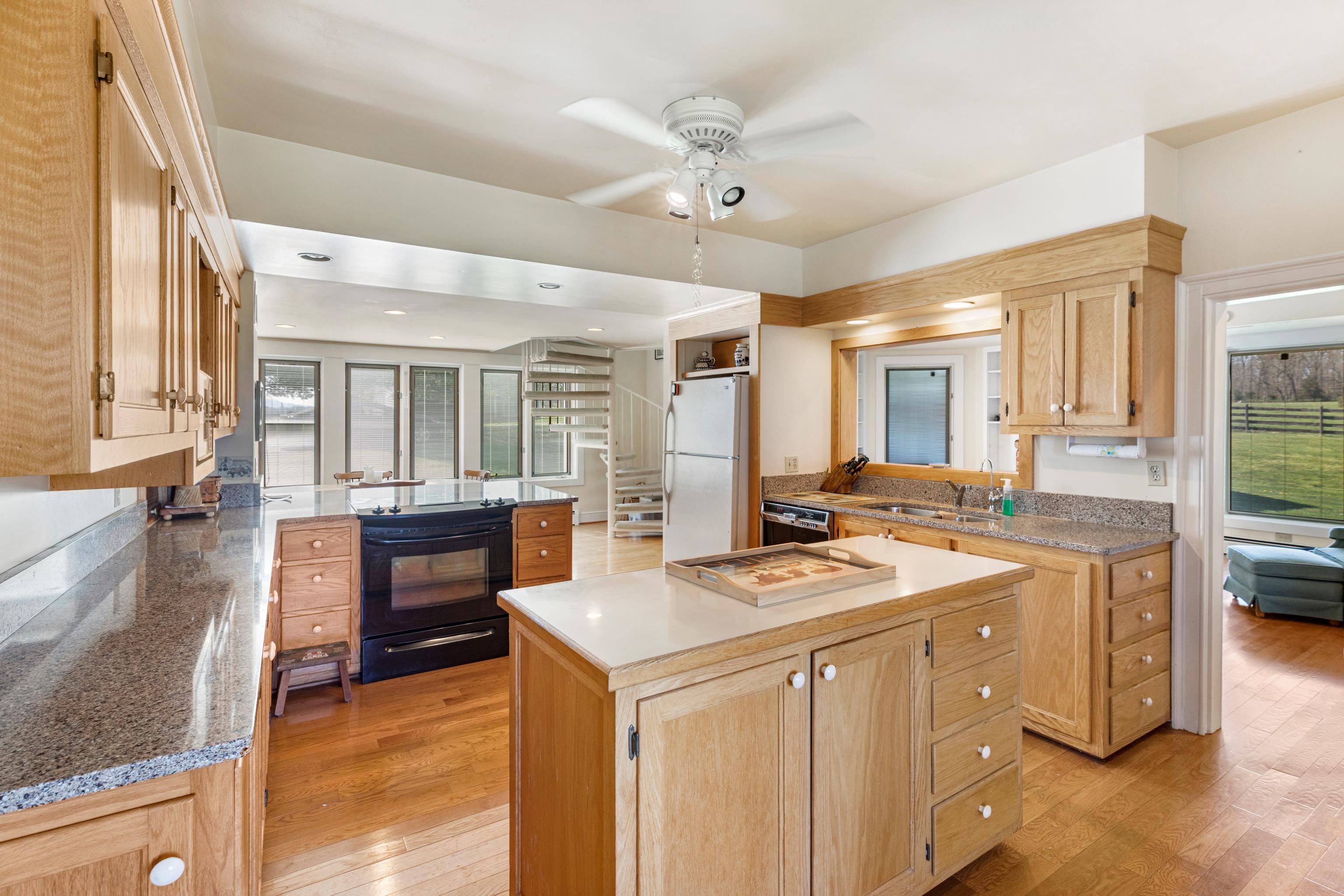 191 Middle River Road Staunton, VA 24401 - Photo 11 of 55 a kitchen that has a sink a stove and chairs