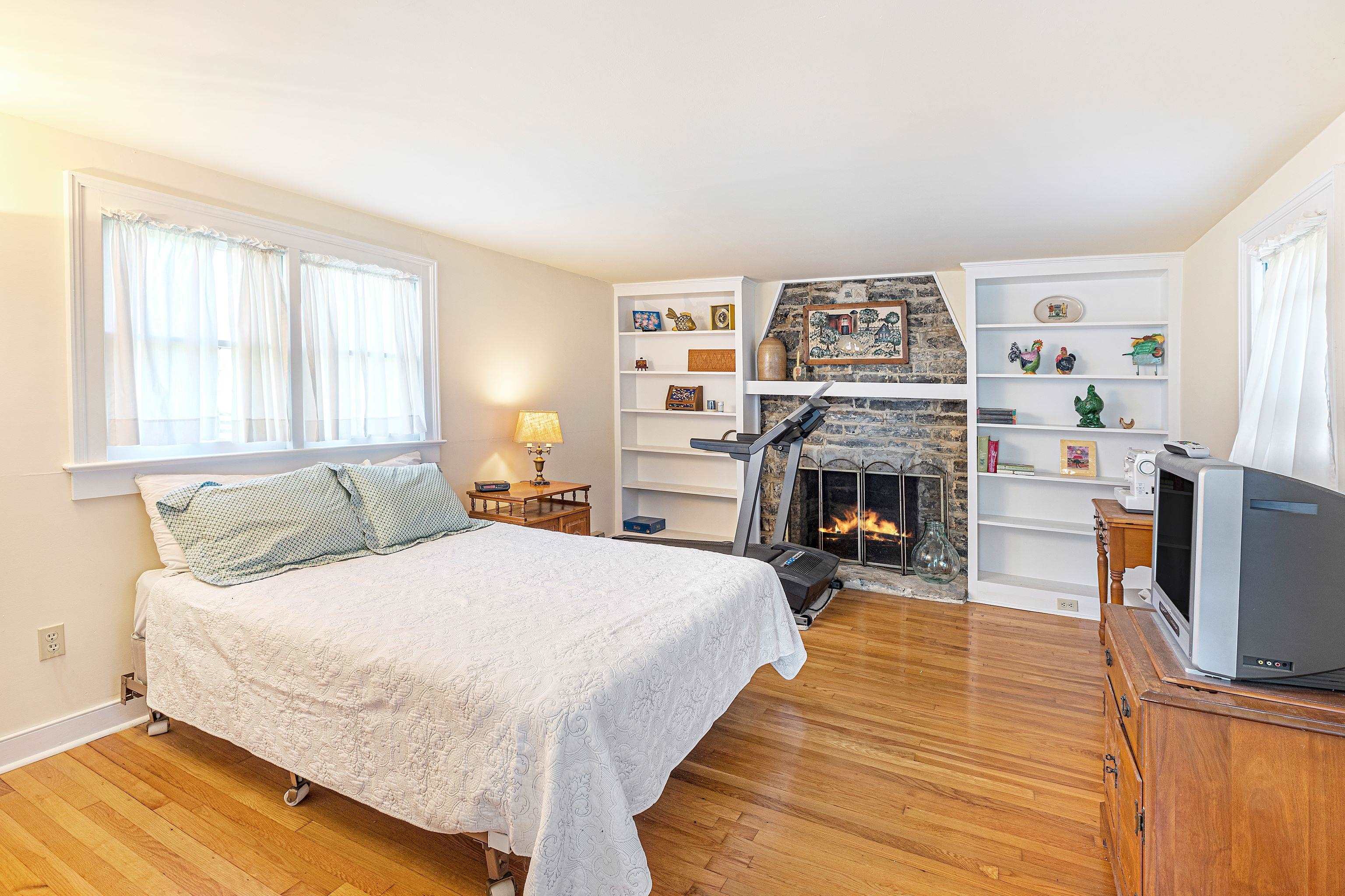 191 Middle River Road Staunton, VA 24401 - Photo 21 of 55 a bedroom with a bed and a fireplace