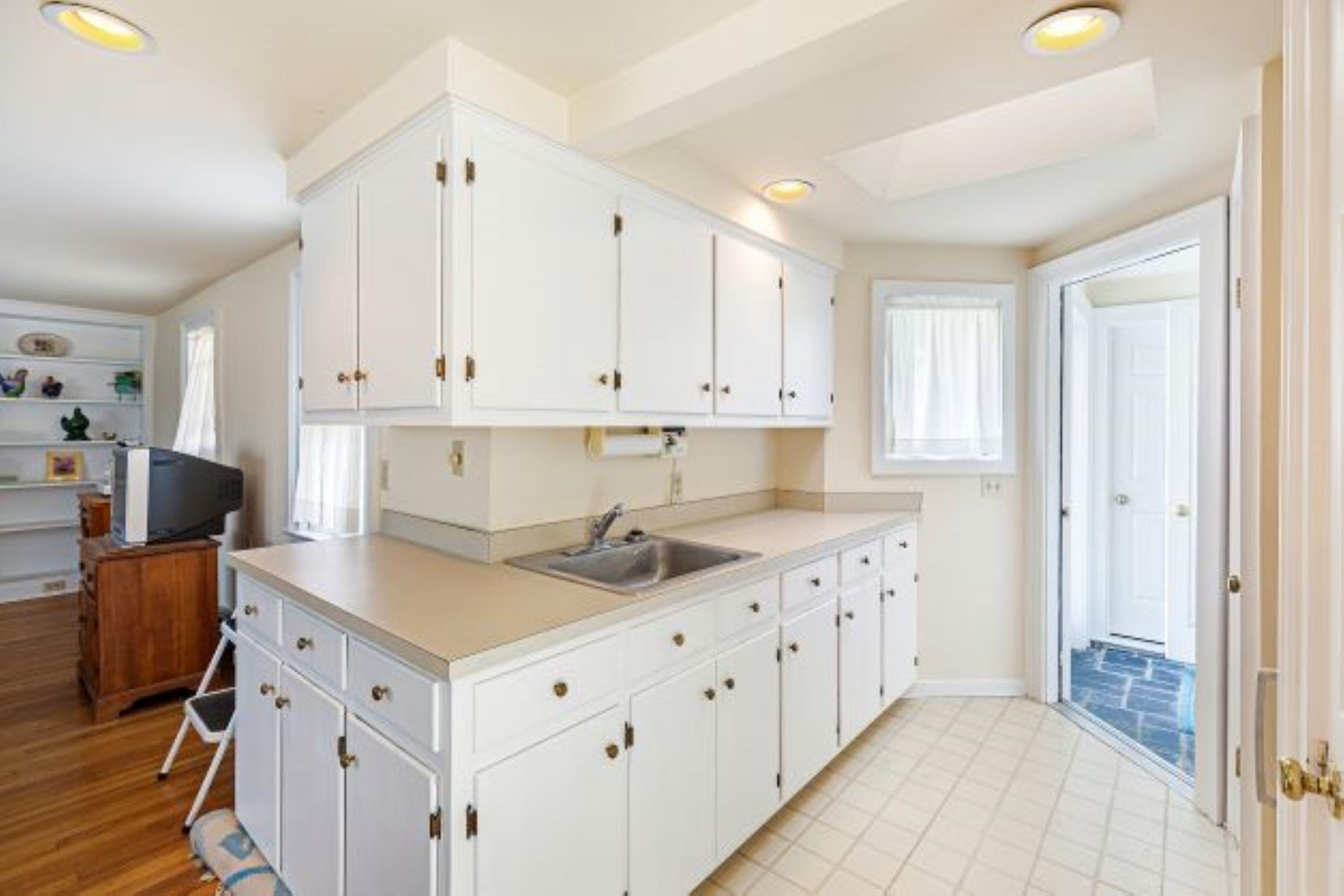 191 Middle River Road Staunton, VA 24401 - Photo 23 of 55 a kitchen with granite countertop a sink stove and cabinets