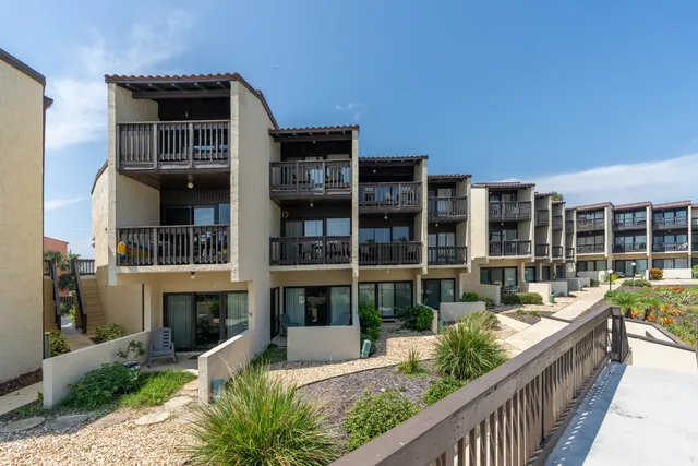 a view of outdoor space with wooden floor and tennis court