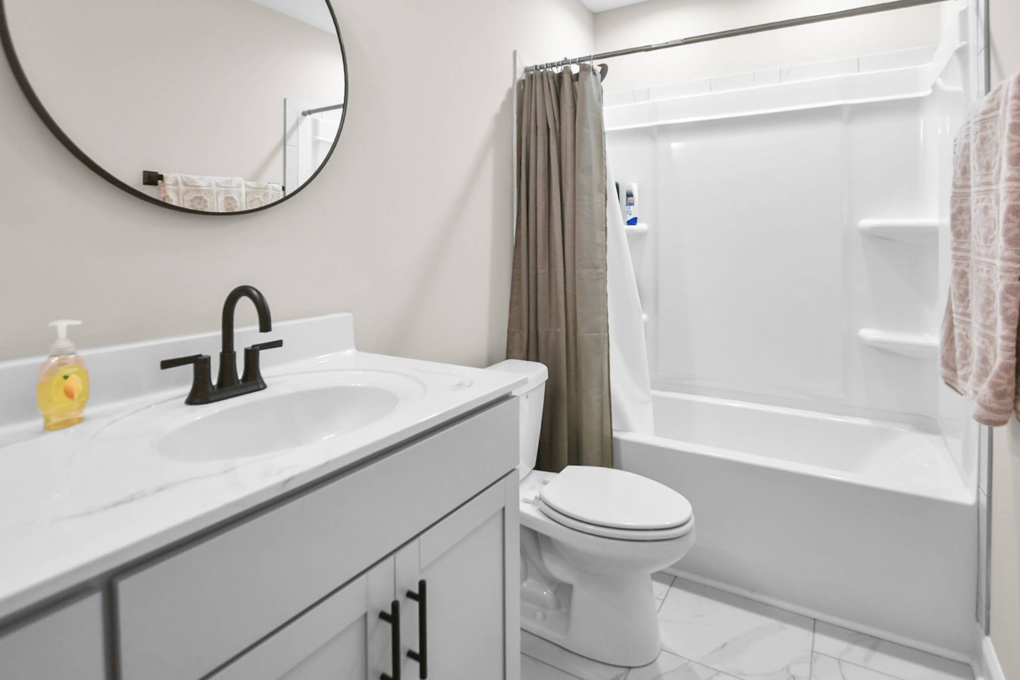 60 Cave Springs Road, Unit B Clarksville, TN 37042 - Photo 14 of 16 a bathroom with a sink a toilet and a mirror