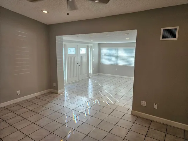 a view of an empty room and window