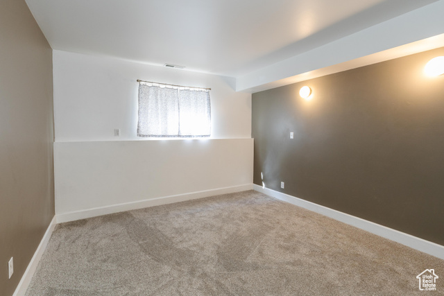 167 East 100 North, Unit B Logan, UT 84321 - Photo 10 of 18 Unfurnished room with light carpet and baseboards
