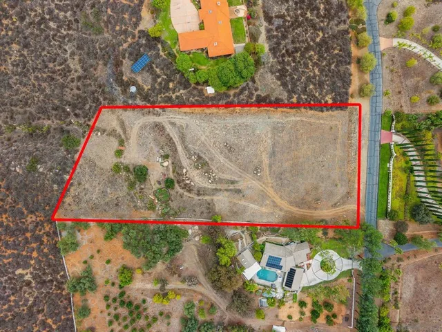 a view of a street with a yard