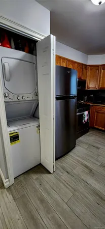 a kitchen with a refrigerator and a stove