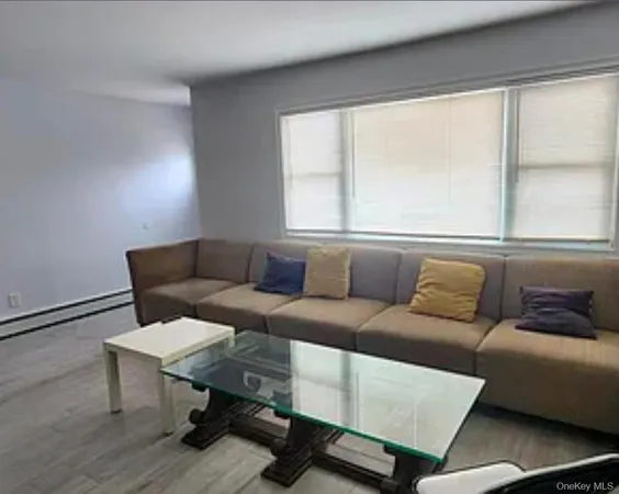 a living room with furniture and a window