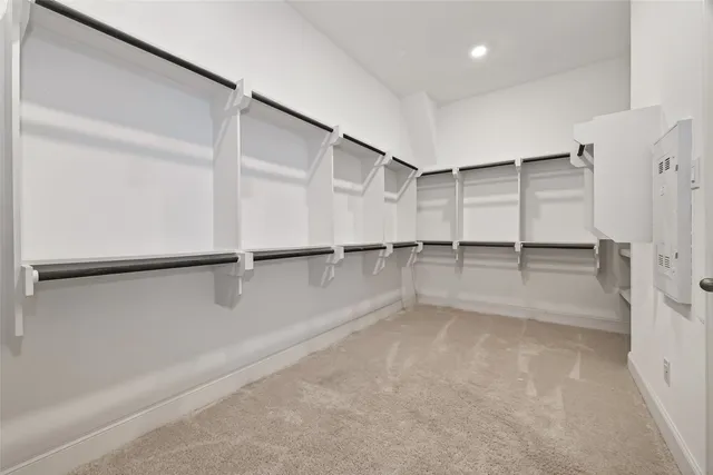 a bedroom with furniture and a ceiling fan