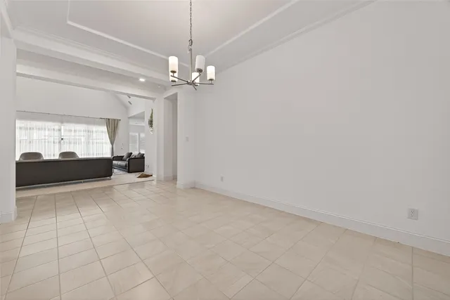 a view of a livingroom with a chandelier fan and furniture