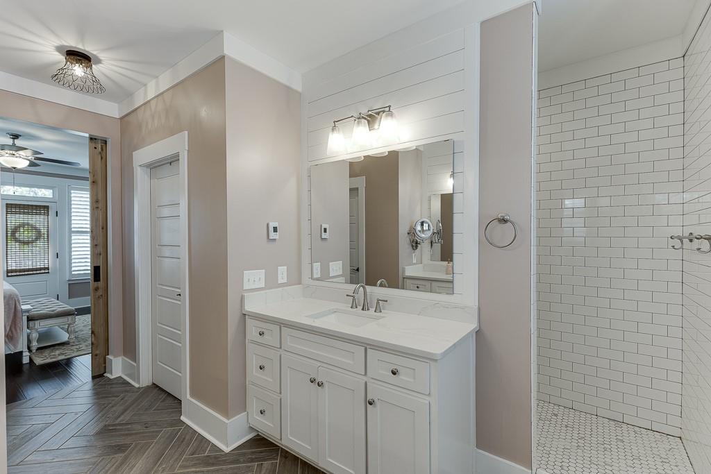 890 Smith Mill Road Winder, GA 30680 - Photo 30 of 95 a bathroom with a double vanity sink and a mirror