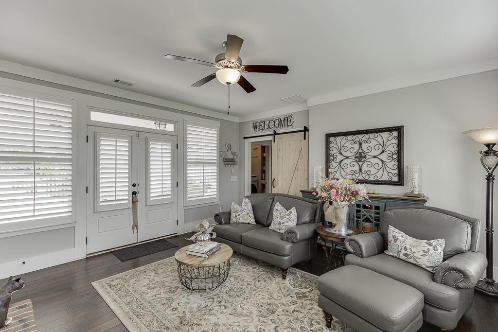 890 Smith Mill Road Winder, GA 30680 - Photo 44 of 95 a living room with furniture and a large window