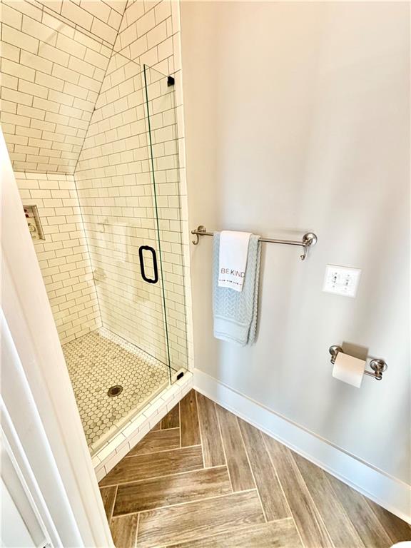 890 Smith Mill Road Winder, GA 30680 - Photo 49 of 95 a bathroom with a tub and shower