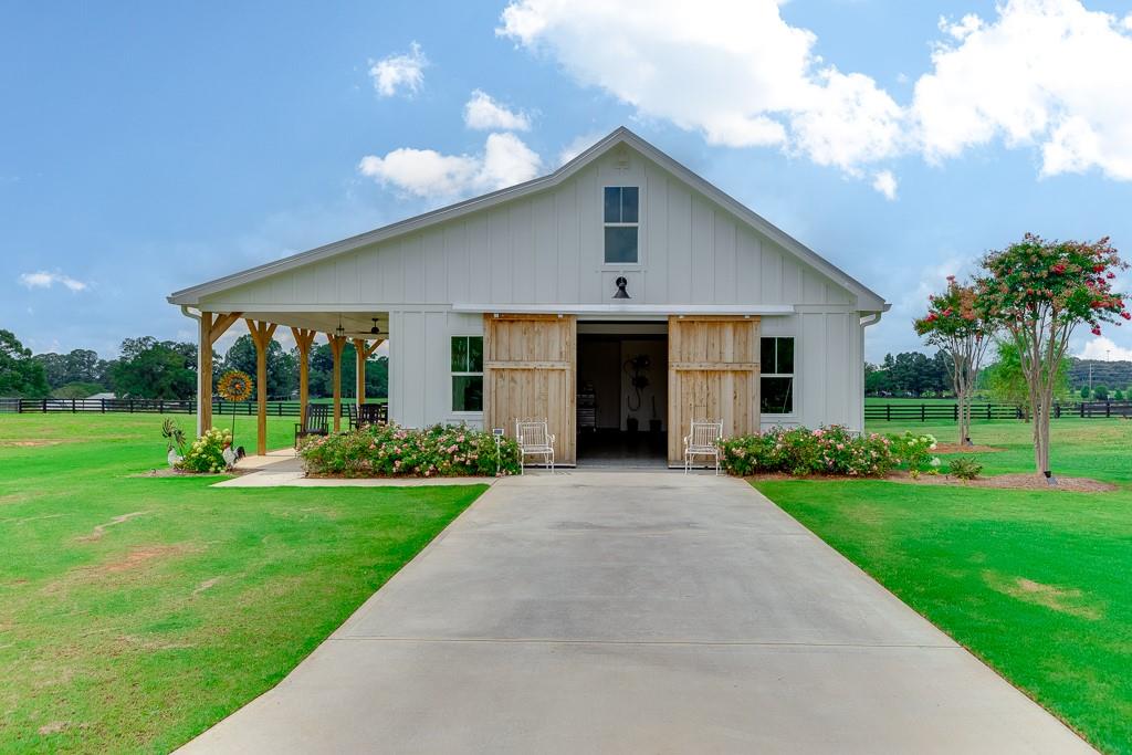 890 Smith Mill Road Winder, GA 30680 - Photo 70 of 95 a front view of a house with a yard and porch