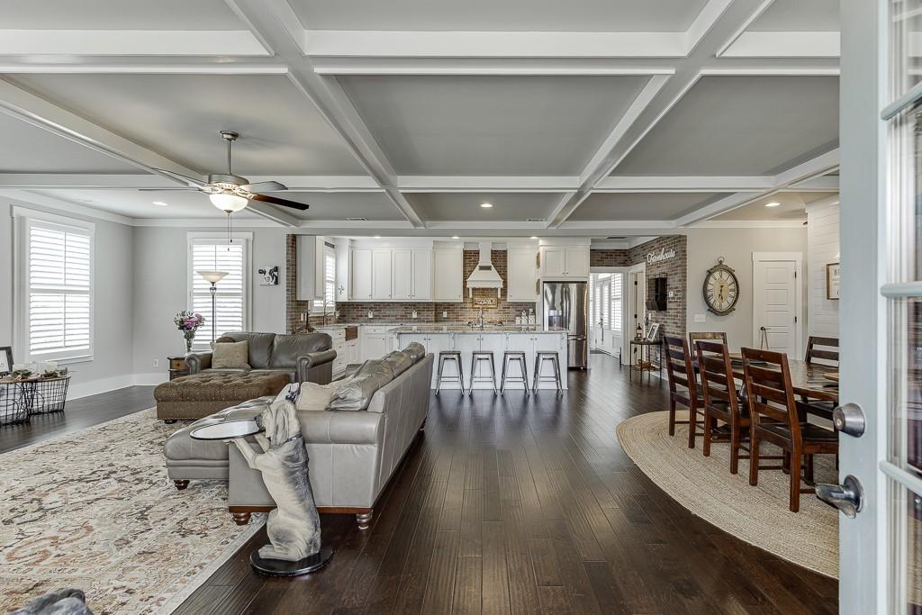 890 Smith Mill Road Winder, GA 30680 - Photo 7 of 95 a living room with lots of furniture and wooden floors