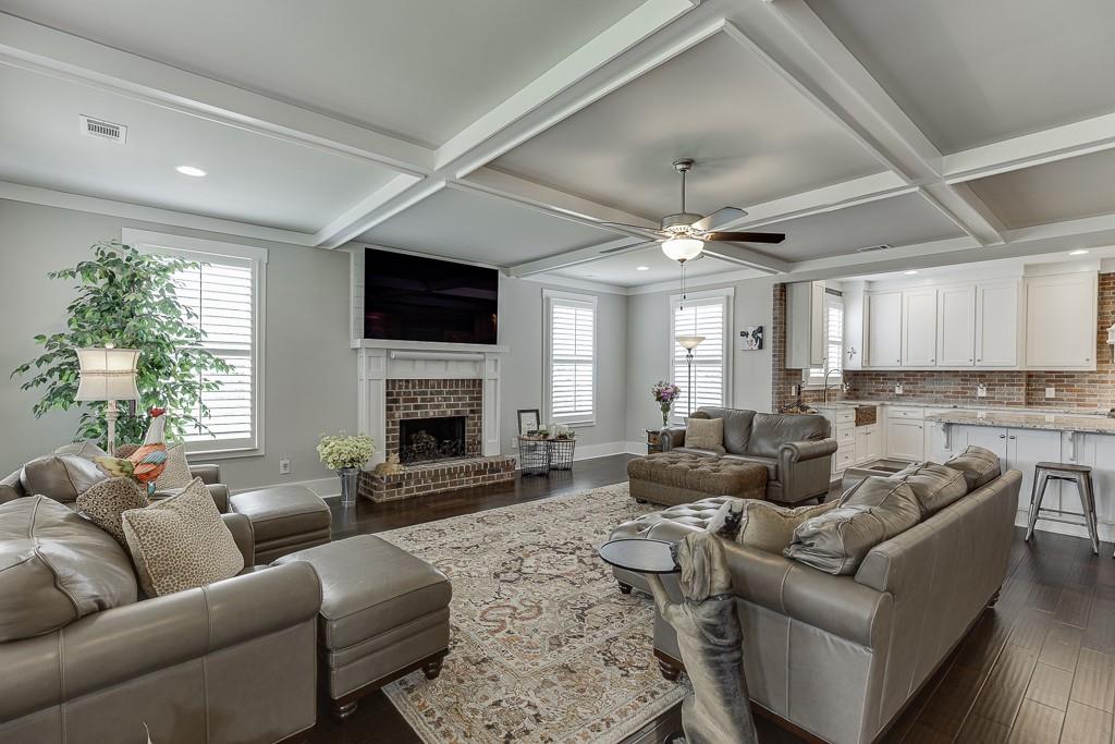 890 Smith Mill Road Winder, GA 30680 - Photo 8 of 95 a living room with furniture fireplace and a flat screen tv
