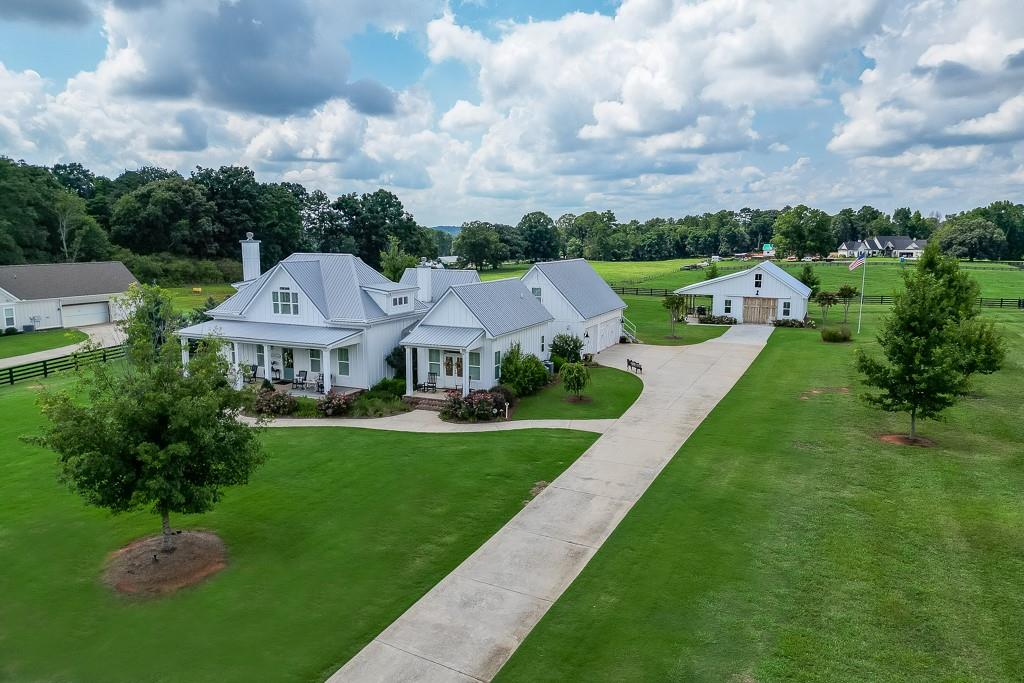 890 Smith Mill Road Winder, GA 30680 - Photo 90 of 95 a view of a house with a big yard plants and large trees