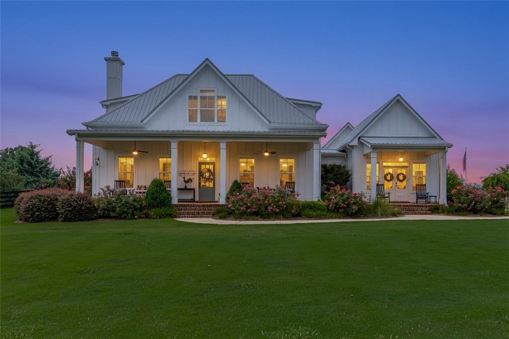 890 Smith Mill Road Winder, GA 30680 - Photo 91 of 95 a front view of a house with a garden